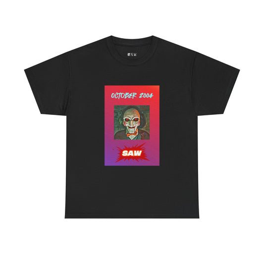 Saw unisex heavyweight tee shirt featuring Jigsaw’s haunting stare, bold “October 2004” above, and a blood-red SAW blast below. A wearable reminder of the game that changed terror foreverand a chilling tribute to horror history.