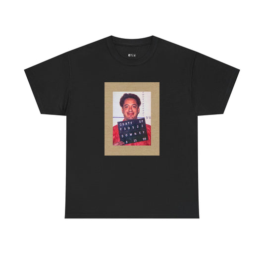 Robert Downey Jr. unisex heavyweight tee shirt featuring his infamous mugshot, a raw symbol of downfall and comeback. Wear it as a statement of grit, chaos, and ultimate redemption.